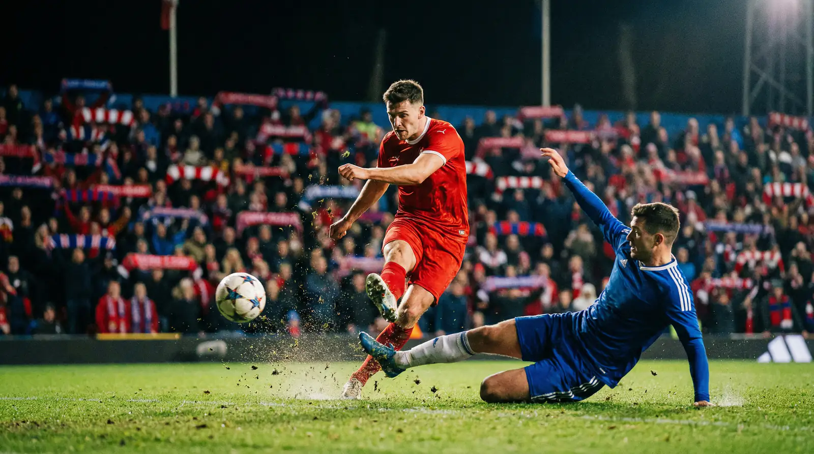 Two football teams competing in a group-stage match under stadium floodlights
